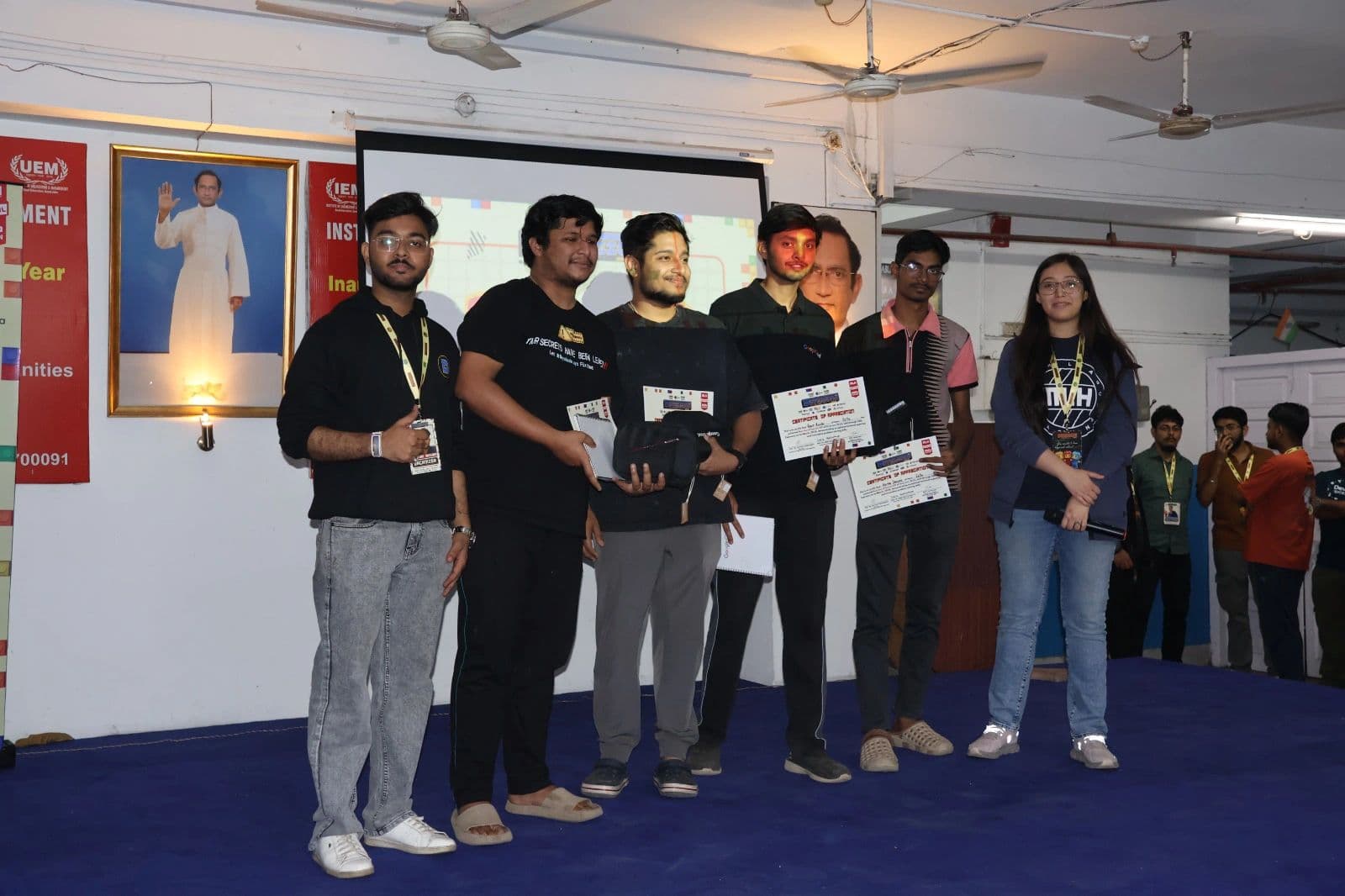 LNC members receiving certificates on stage