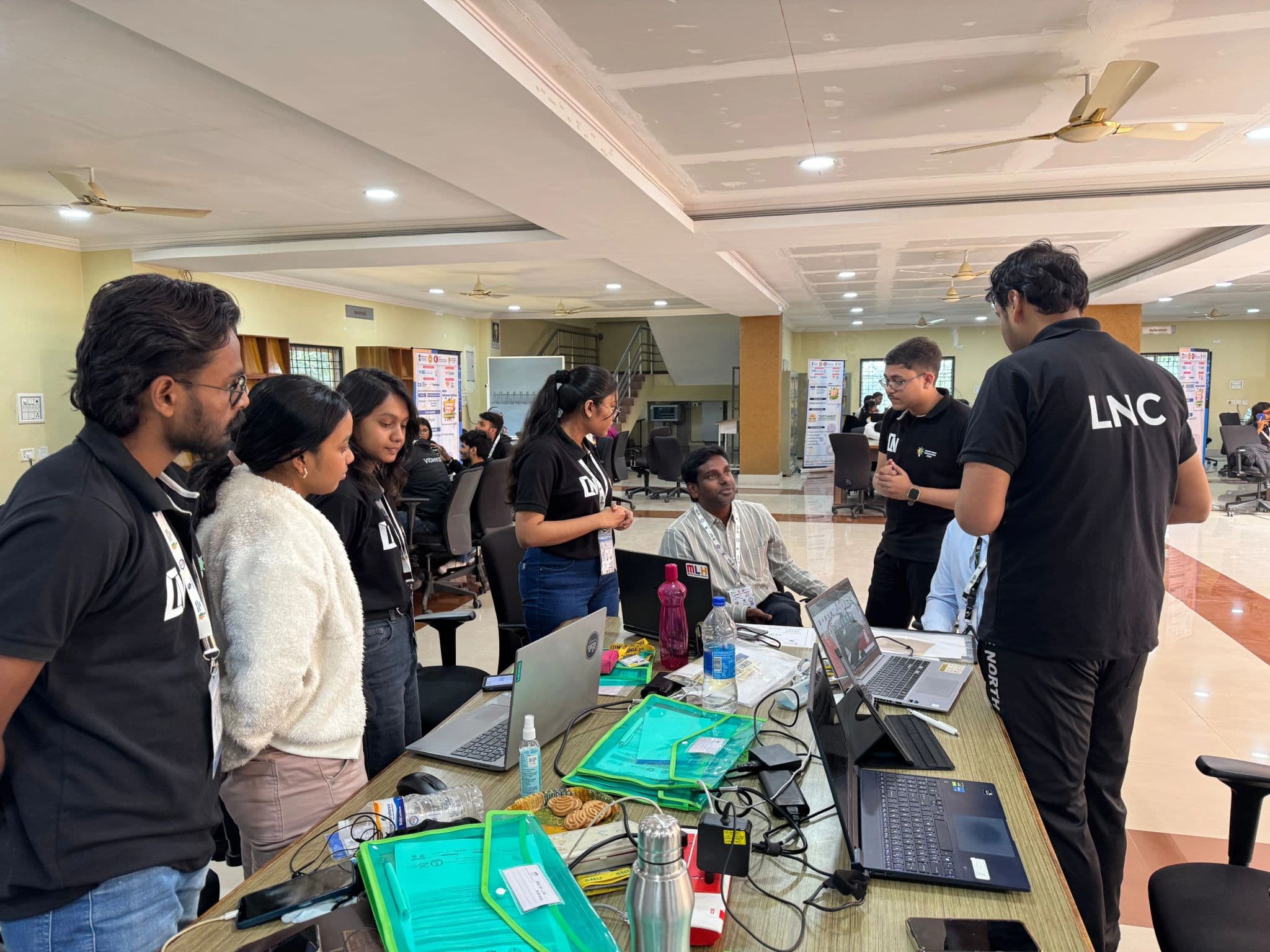 LNC members presenting a robotics project at a demo booth