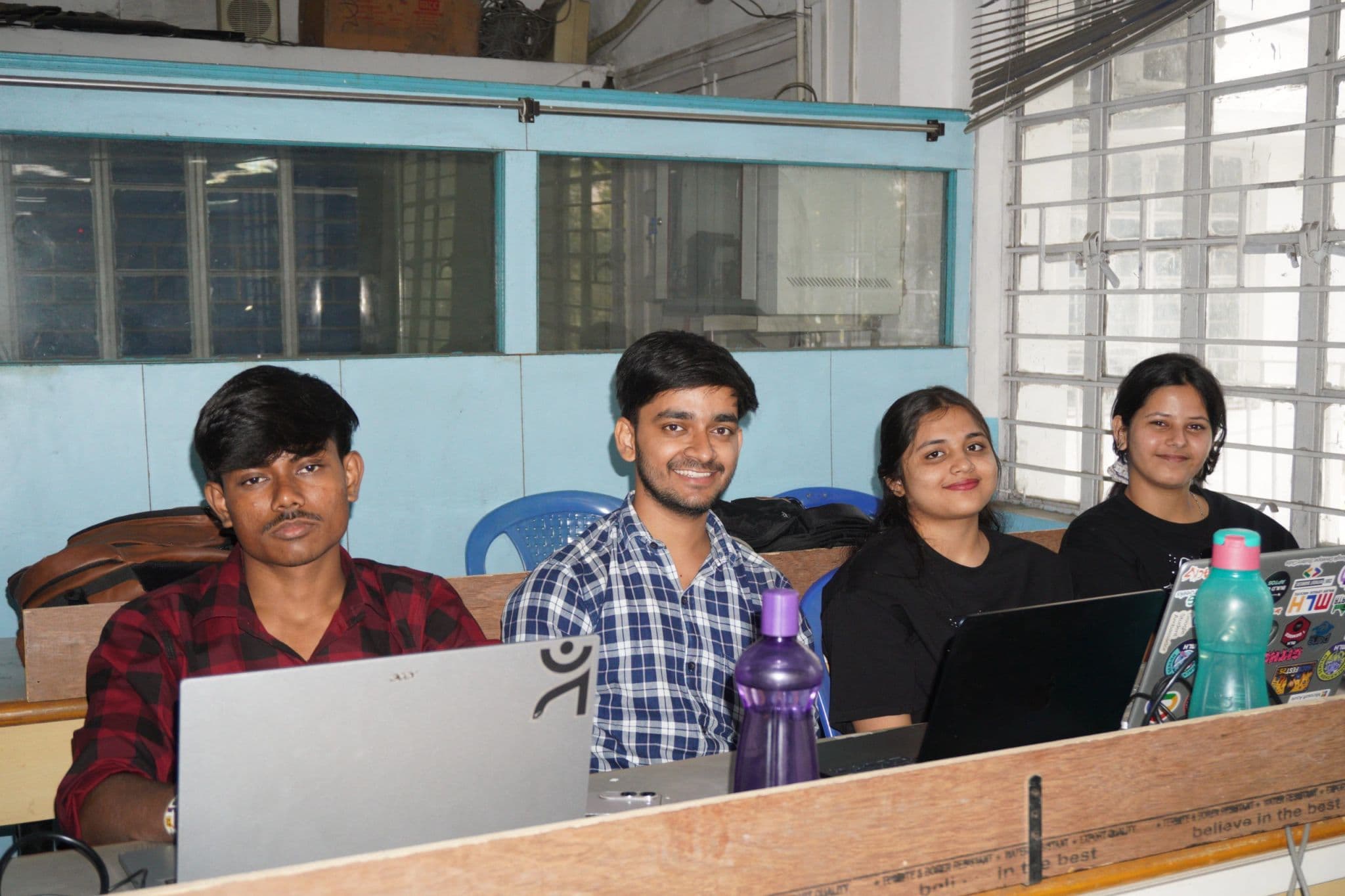 Hackathon participants working together in a lab