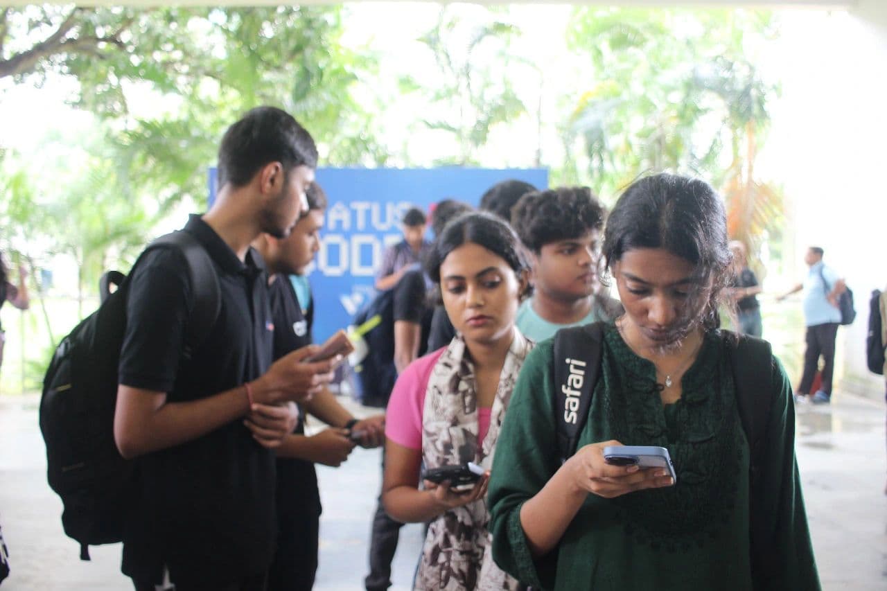 Volunteers helping attendees at an outdoor registration desk