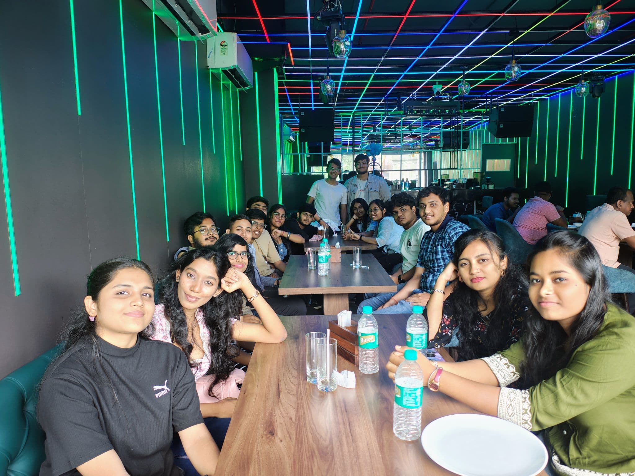 LNC community members gathered around a restaurant table
