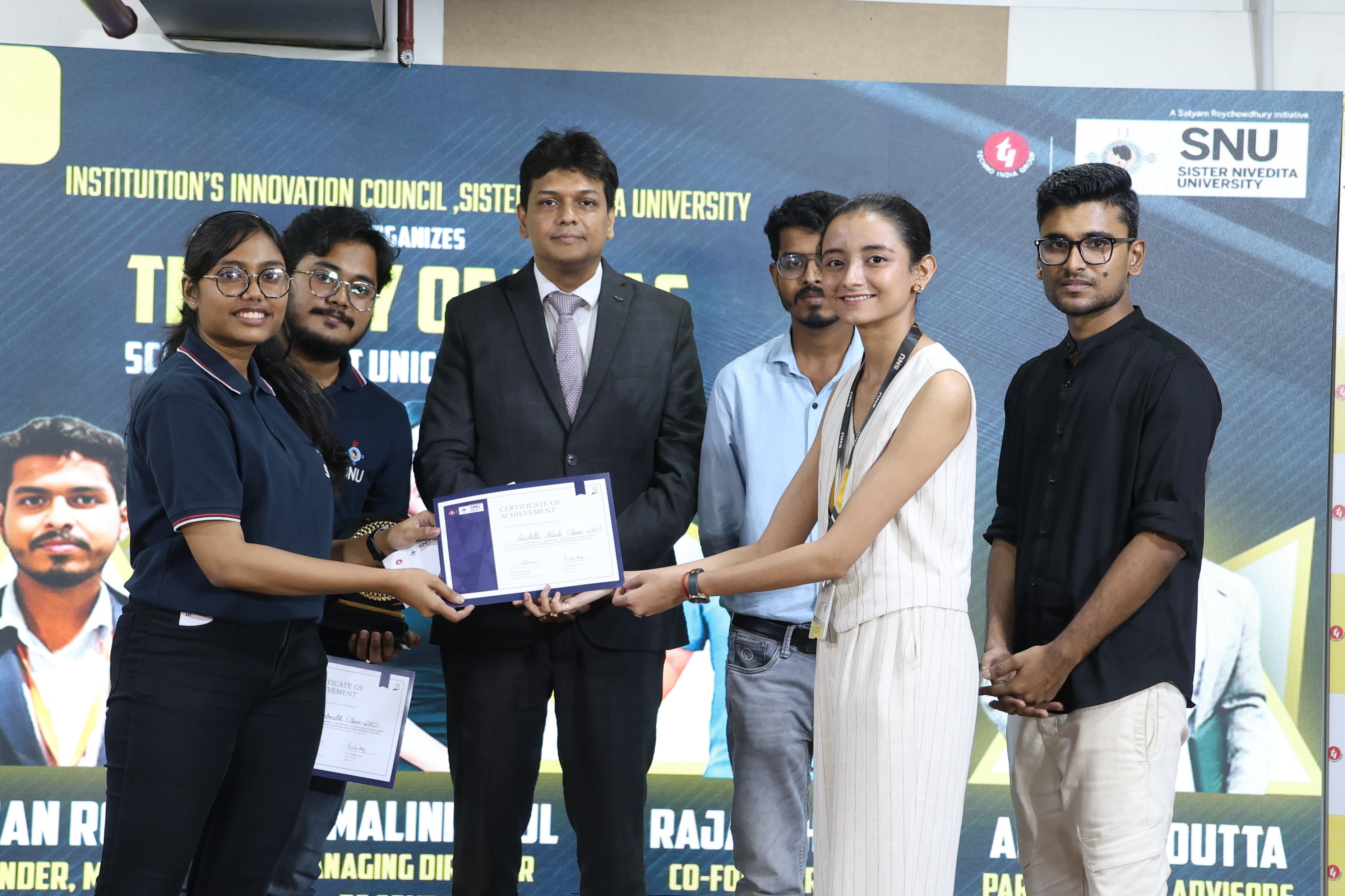 LNC team receiving a certificate of achievement at Sister Nivedita University